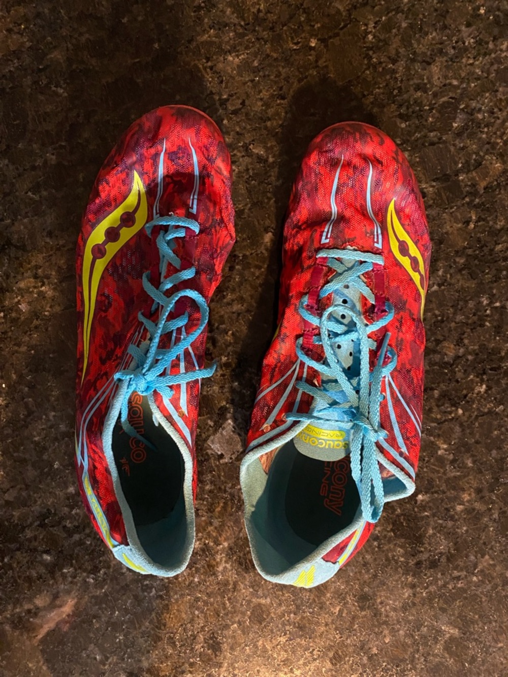 Saucony Red Athletic Shoes with Yellow and Light Blue Accents